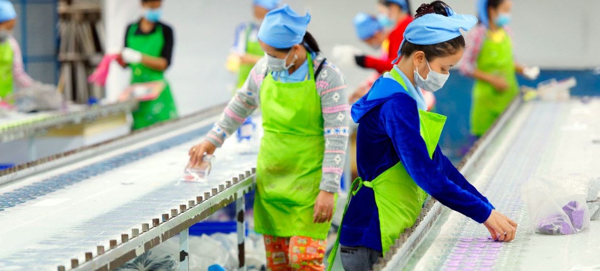 Factory workers in an assembly line in Cambodia